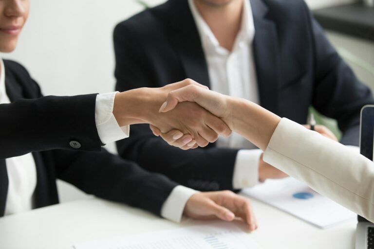 Follow up after networking event Leicester – professional follow-up meeting and handshake